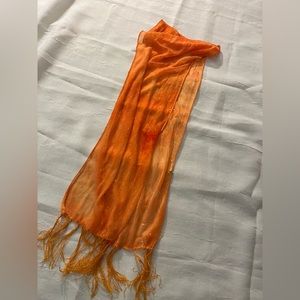 Sheer orange scarf with fringe and “diamond” dots.